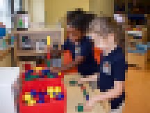 Two students in the classroom's science center