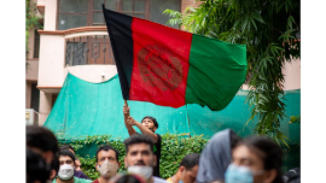 Afghan boy with flag